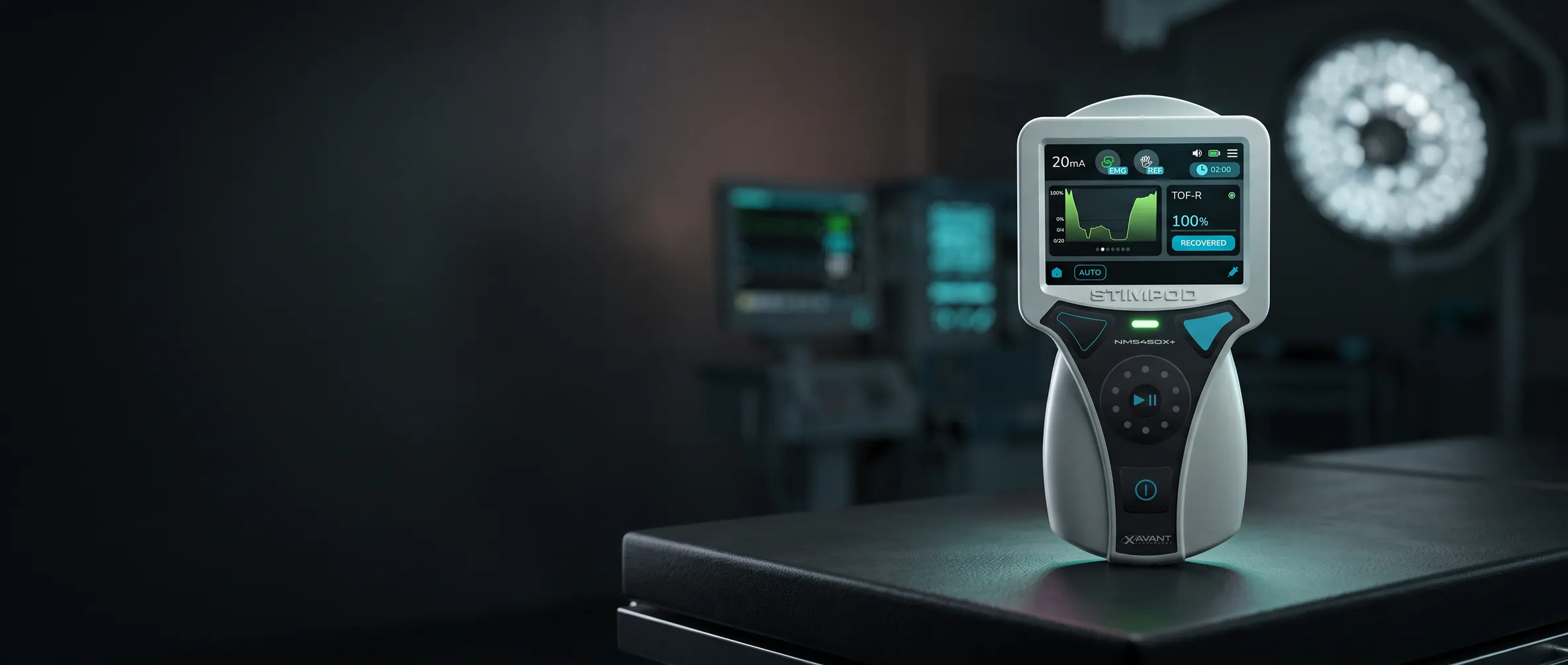 Stimpod NMS450X+ standing lit on a dark operating table, teal monitor glow behind