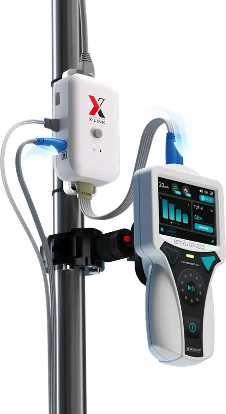X-Link mounted on an IV pole with a Stimpod NMS450X+ docked beside it, network cable entering the top